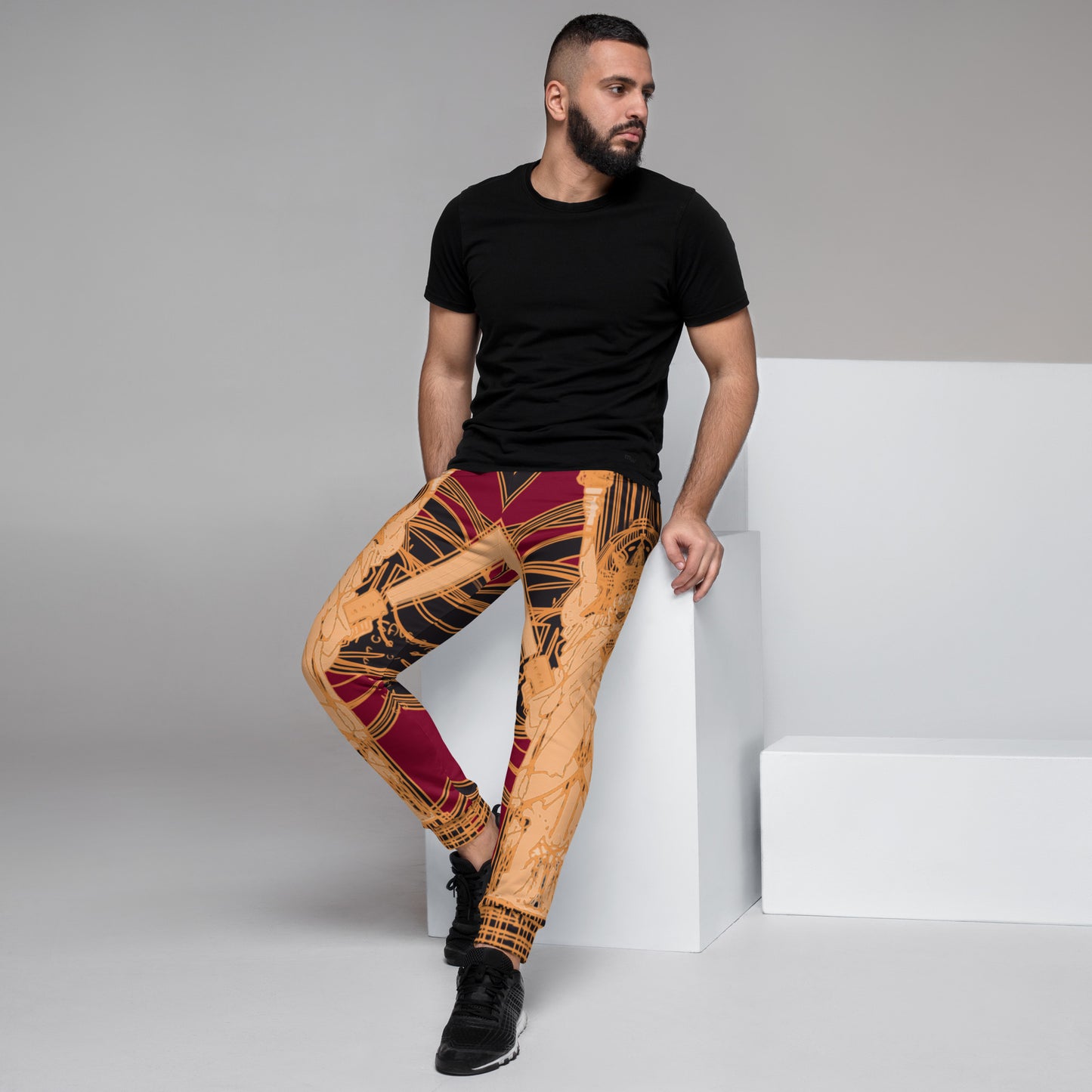 Model Sitting Wearing Black and Red Joggers with Golden Statue of Liberty Design - ARAWMANTICKS